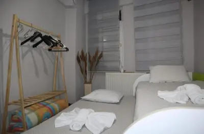 a bedroom with two beds with towels on them at Pink OLD CITY 1 in Istanbul