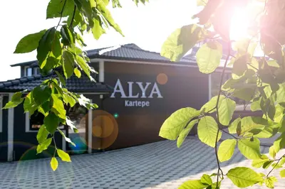 a building with aza taza sign in the background at Alya Kartepe Villa Hotel in Kocaeli