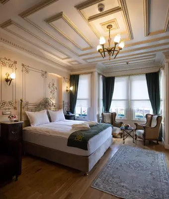 a bedroom with a bed and a coffered ceiling at Hotel Turkish House in Istanbul