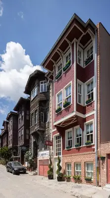 a pink building on the side of a street at Hotel Turkish House in Istanbul