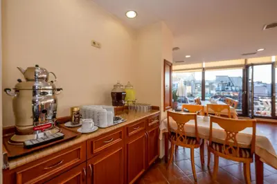 a kitchen with a table with a coffee maker on it at Hotel Erdal in Istanbul