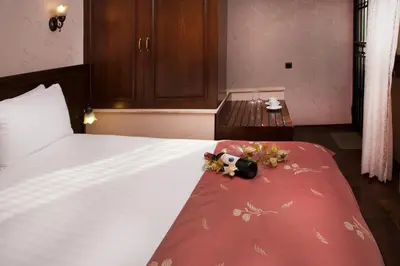 a bedroom with a bed with flowers on it at Sultanahmet Suites in Istanbul