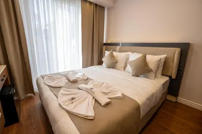 a hotel room with a bed with towels on it at Navoris Hotel in Istanbul