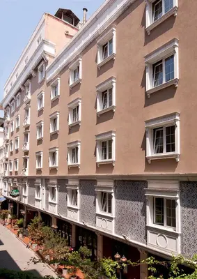 a large building with white windows on a street at Hotel Sapphire in Istanbul