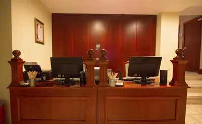 a courtroom with two computers on top of a desk at Sirkeci Mansion in Istanbul