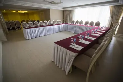 a long table in a room with chairs at World Point Hotel Istanbul in Istanbul