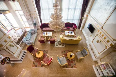 an overhead view of a living room with a chandelier at World Point Hotel Istanbul in Istanbul
