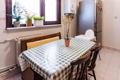 a dining room table with a checkered table cloth on it at Kaplan Cosy Flat - All air conditioned & Heated 3 Bedrooms in the City in Istanbul