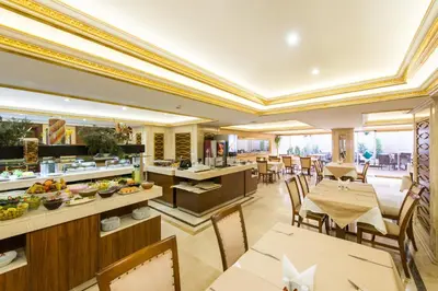 a restaurant with tables and chairs and a buffet at Antea Hotel Oldcity -Special Category in Istanbul