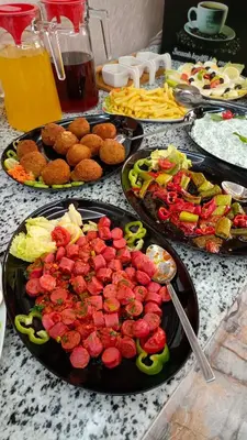 a table with several plates of food on a table at BALPETEK HOTEL in Istanbul