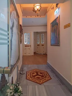 a hallway with a rug on the floor at Ragip Pasha Apartments in Istanbul