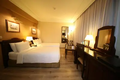 a hotel room with a bed and a mirror at Cartoon Hotel in Istanbul
