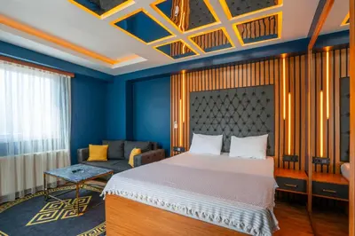 a bedroom with a bed and a couch at Royal Nest in Istanbul