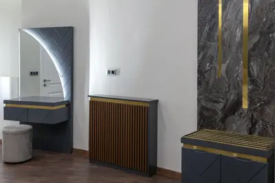 a bathroom with two benches and a mirror at Nm Suites Beyoglu in Istanbul