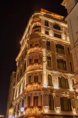 a tall white building with christmas lights on it at Hotel De Reve Galata-Special Class in Istanbul