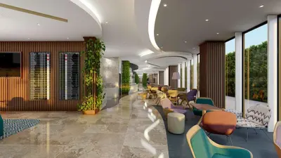 a lobby with chairs and tables and windows at Hampton By Hilton Istanbul Airport, Arnavutkoy in Istanbul