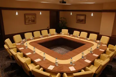 a meeting room with a large table and chairs at Byotell Istanbul in Istanbul