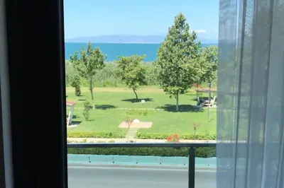 a view of a park from a window at ANTİGONİA BUTİK OTEL in İznik