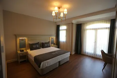 a hotel room with a bed and a television at HaciBayramHotel in Istanbul