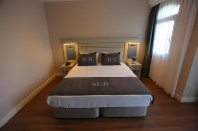 a bedroom with a large bed with two pillows at HaciBayramHotel in Istanbul