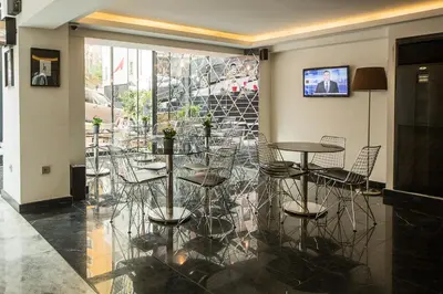 a group of tables and chairs in a room at Semsan Hotel in Istanbul