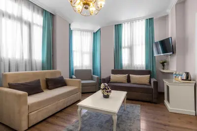 a living room with a couch and a table at Valide Hotel in Istanbul