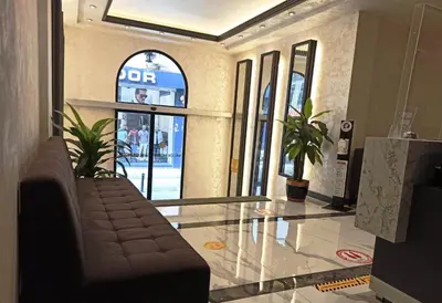 a lobby with a couch and a glass floor at Valide Hotel in Istanbul