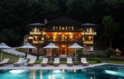 a house with a swimming pool in front of a house at Casa Giallo Managed By Dedeman in Sapanca