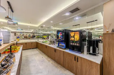 a large kitchen with a counter in a store at Hamitbey Hotel Yenikapı in Istanbul