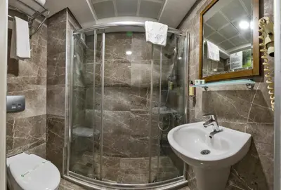 a bathroom with a shower and a sink at Laleli Gonen Hotel in Istanbul