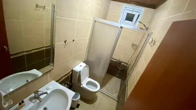 a bathroom with a sink and a toilet and a shower at Herton Boutique Hotel in Istanbul