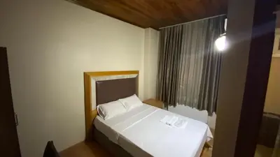 a bedroom with a white bed and a window at Herton Boutique Hotel in Istanbul