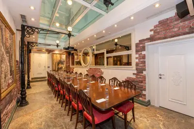a long dining room with a long table and chairs at Pera Tulip Hotel & Spa in Istanbul