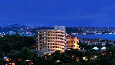 a tall building with a sign on top of it at Conrad Istanbul Bosphorus in Istanbul
