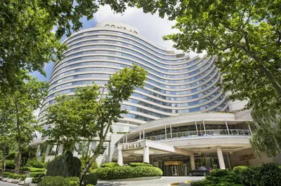 a large building with a sign on top of it at Conrad Istanbul Bosphorus in Istanbul