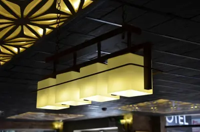 a chandelier hanging from the ceiling in a restaurant at Grand Park Hotel Corlu City Center Bed and Breakfast in Corlu