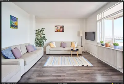 a living room with a couch and a tv at A Million Dollar View In the Heart of the City in Istanbul