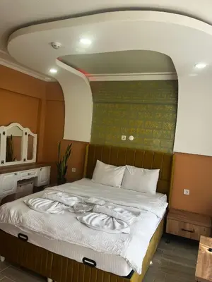 a large bed in a room with an arched ceiling at CEMRE SUIT in Istanbul