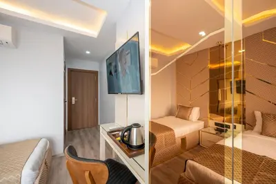 two pictures of a hotel room with a bedroom at Luxury Airport Hotel By Zazzoni-İstanbul Airport in Arnavutköy