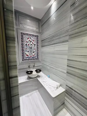 a bathroom with a sink and a mirror at Grand Yavuz Hotel Sultanahmet in Istanbul