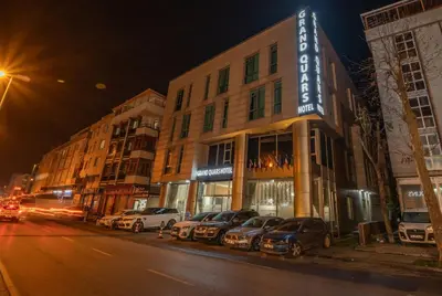 a row of cars parked in front of a building at Grand Quars Hotel in Avcılar