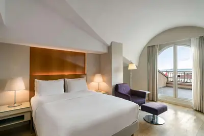 a bedroom with a large white bed and a window at Radisson Blu Bosphorus Hotel in Istanbul