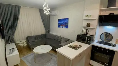 a small living room with a couch and a table at Classic Suite BH13 in Esenyurt
