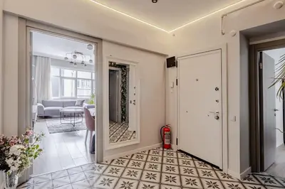 a room with a hallway with a door and a living room at Central Istanbul, Luxury 3BR, 4 min to Metro in Istanbul