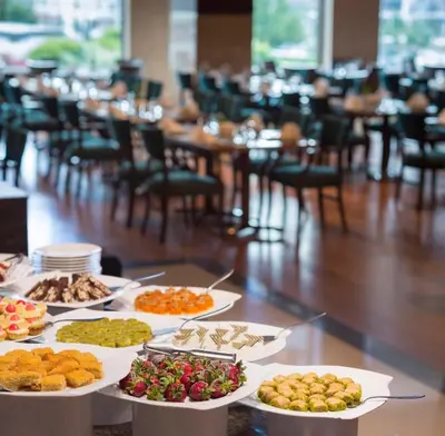 a buffet of food on a table in a restaurant at Titanic Business Kartal in Istanbul