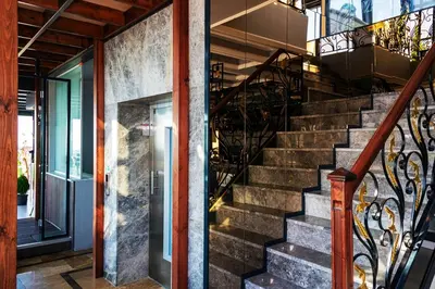 a staircase in a house with a wrought iron railing at Skalion Hotel in Istanbul