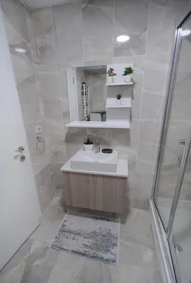 a bathroom with a sink and a shower at King Suite SS2 in Esenyurt