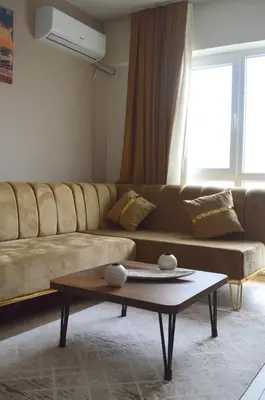 a living room with a couch and a coffee table at Classic Suite MS33 in Esenyurt