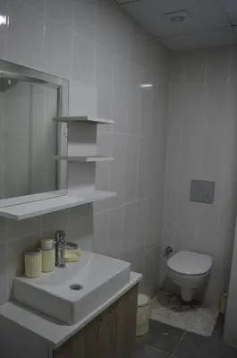 a bathroom with a sink and a toilet at Classic Suite MS33 in Esenyurt