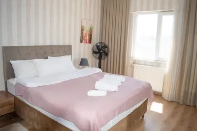 a bedroom with a bed with towels on it at King Suite TC1 in Esenyurt